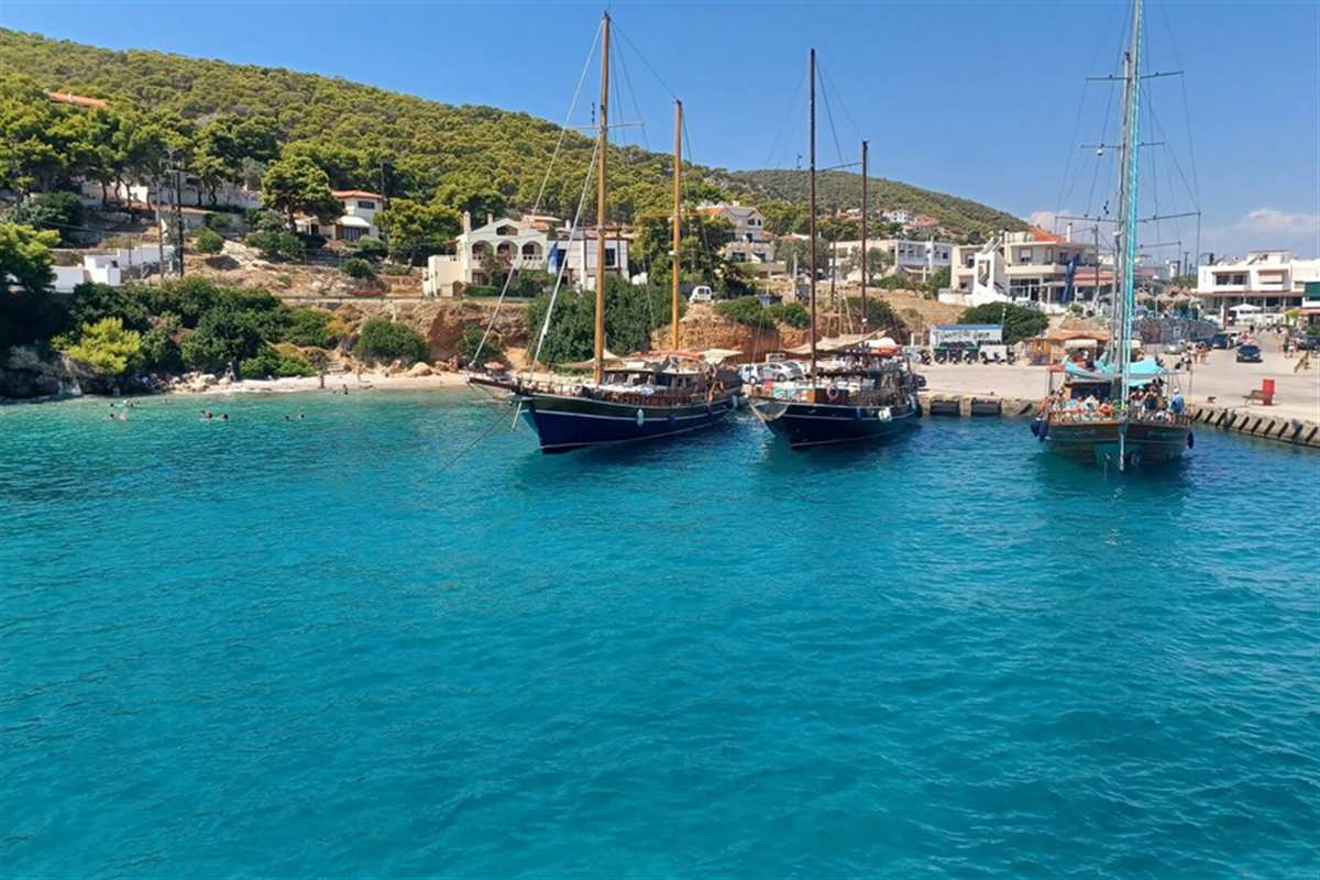 Wooden sailing boats in the turquoise harbour of Agistri island, Agistri boat trip