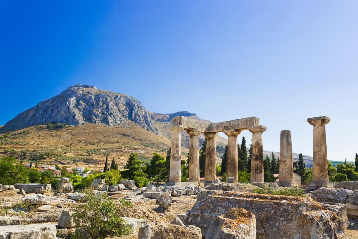 The Temple of Apollo below the rock of Acrocorinth on an Ancient Corinth tour