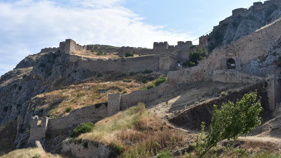 The walls and gates of Acrocorinth climbing the hill on an Ancient Corinth tour