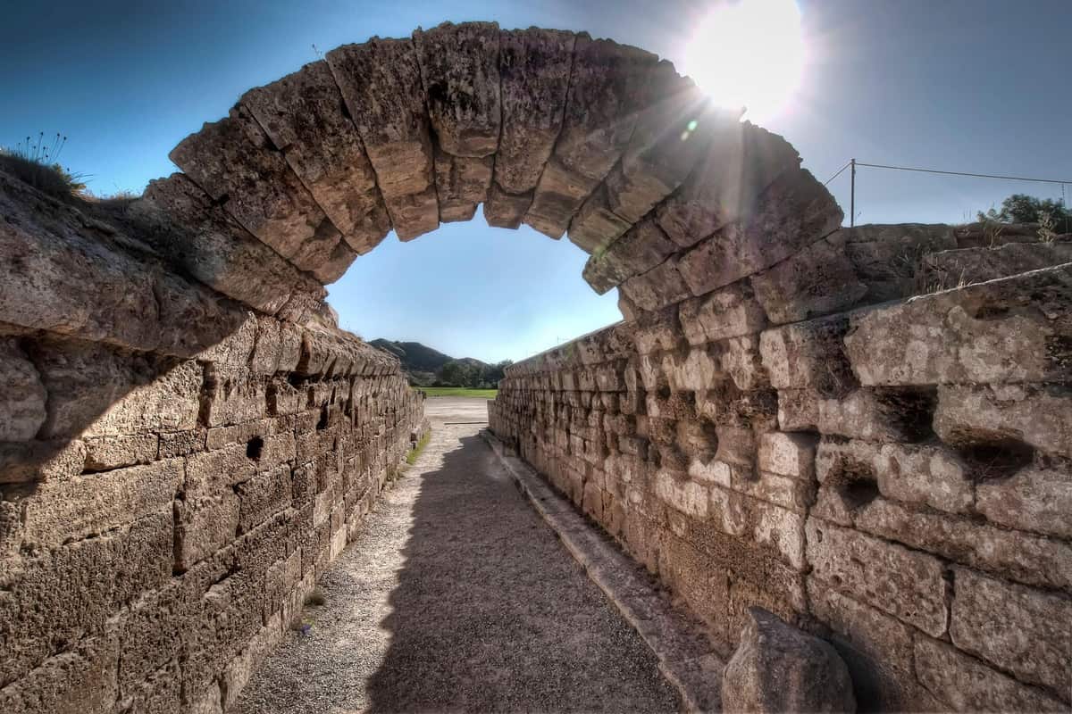 The vaulted stone entrance to the ancient stadium on an ancient Olympia tour