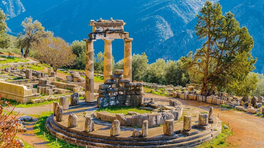 The round Tholos of Delphi below Mount Parnassus on an Athens day trip