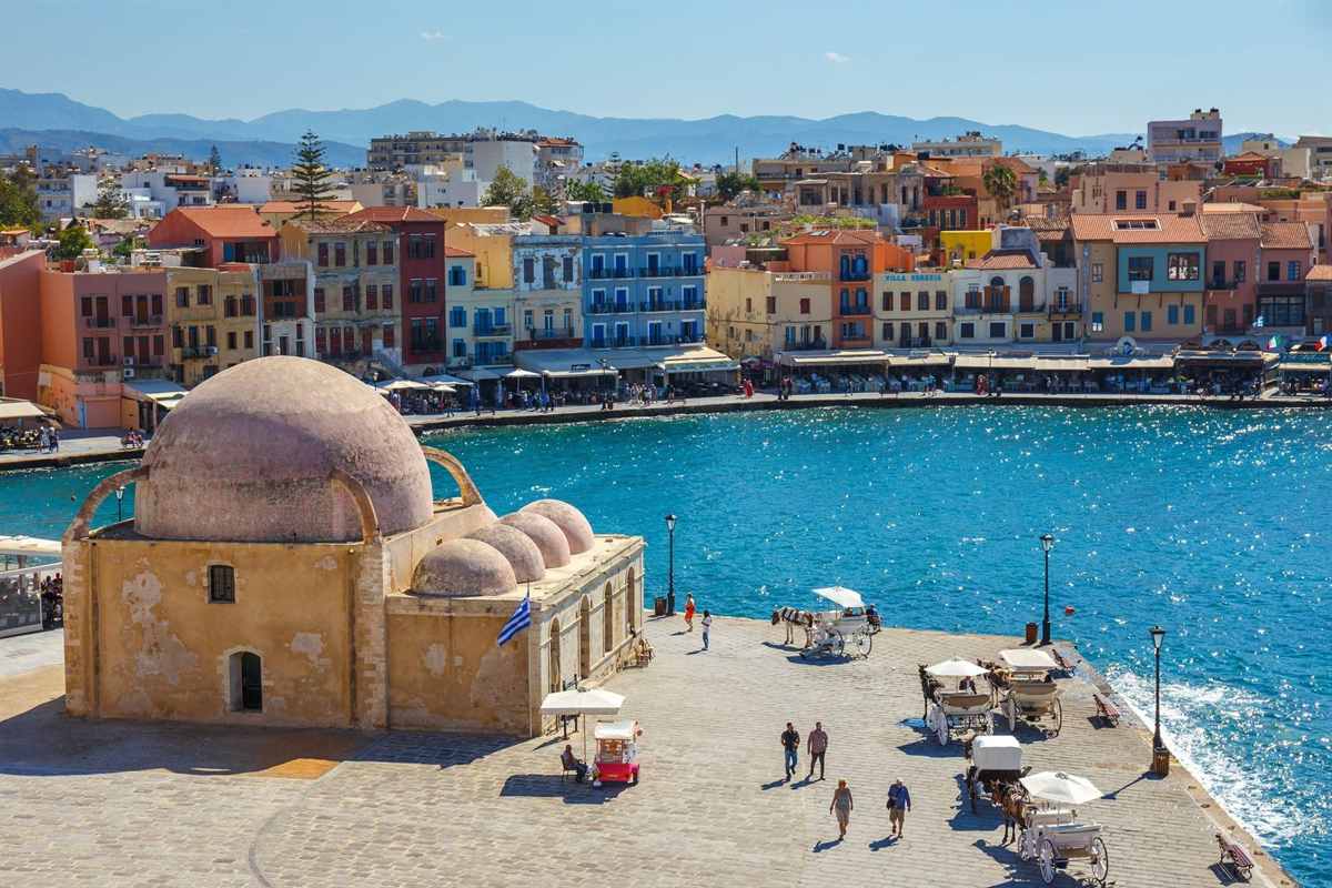 The domed harbour mosque and the Venetian harbour of Chania seen from above, the start of a Chania walking tour