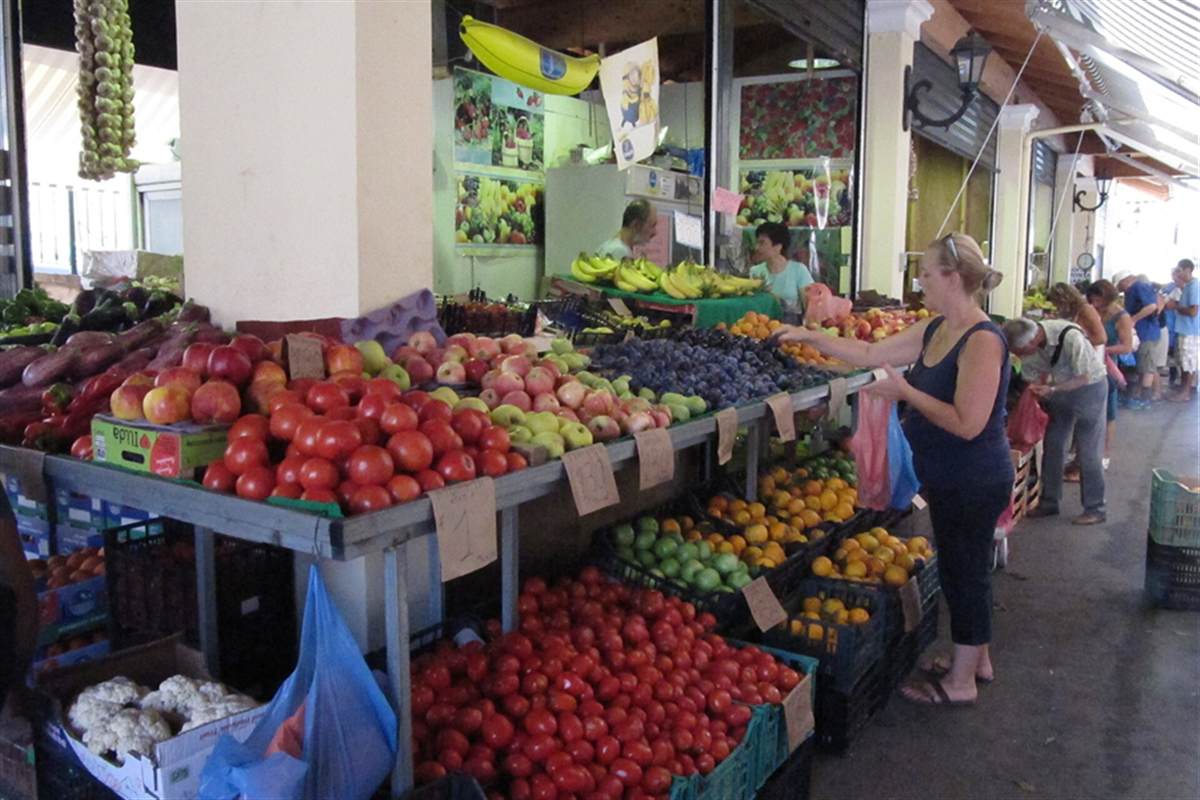 Produce stalls at the market in Corfu Town, a stop on a Corfu food tour
