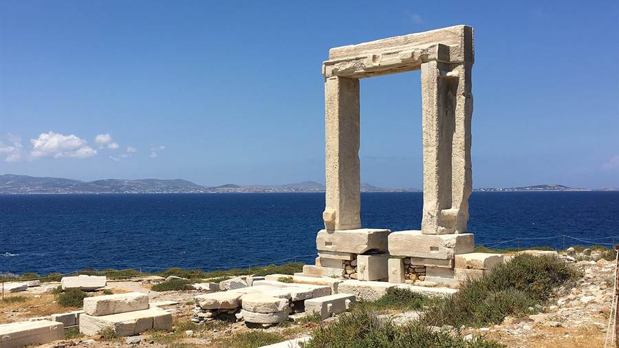 The marble Portara gateway on Naxos above the sea, a stop on Cyclades tours