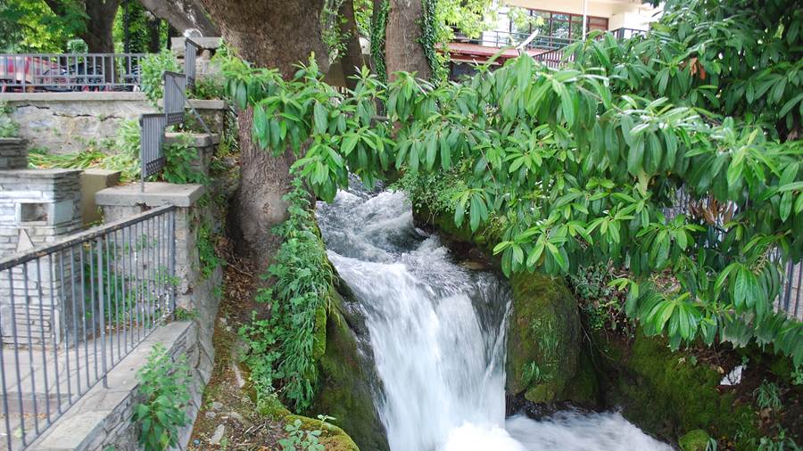 A waterfall at Edessa among green trees, a stop on day trips from Thessaloniki