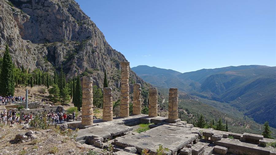 Temple of Apollo terrace at Delphi with columns and the Parnassus mountain slopes