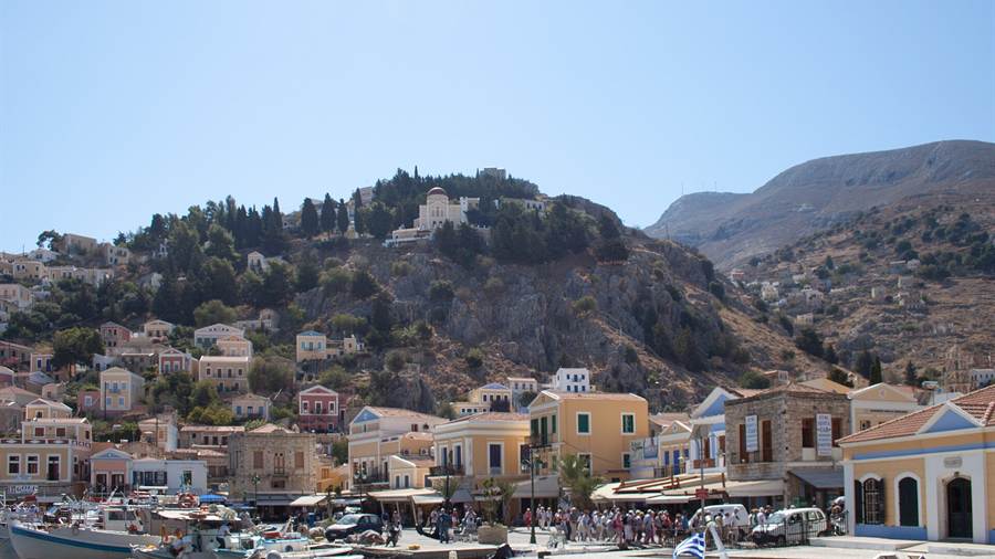 Neoclassical houses climbing the hill above the harbour of Symi on Dodecanese tours