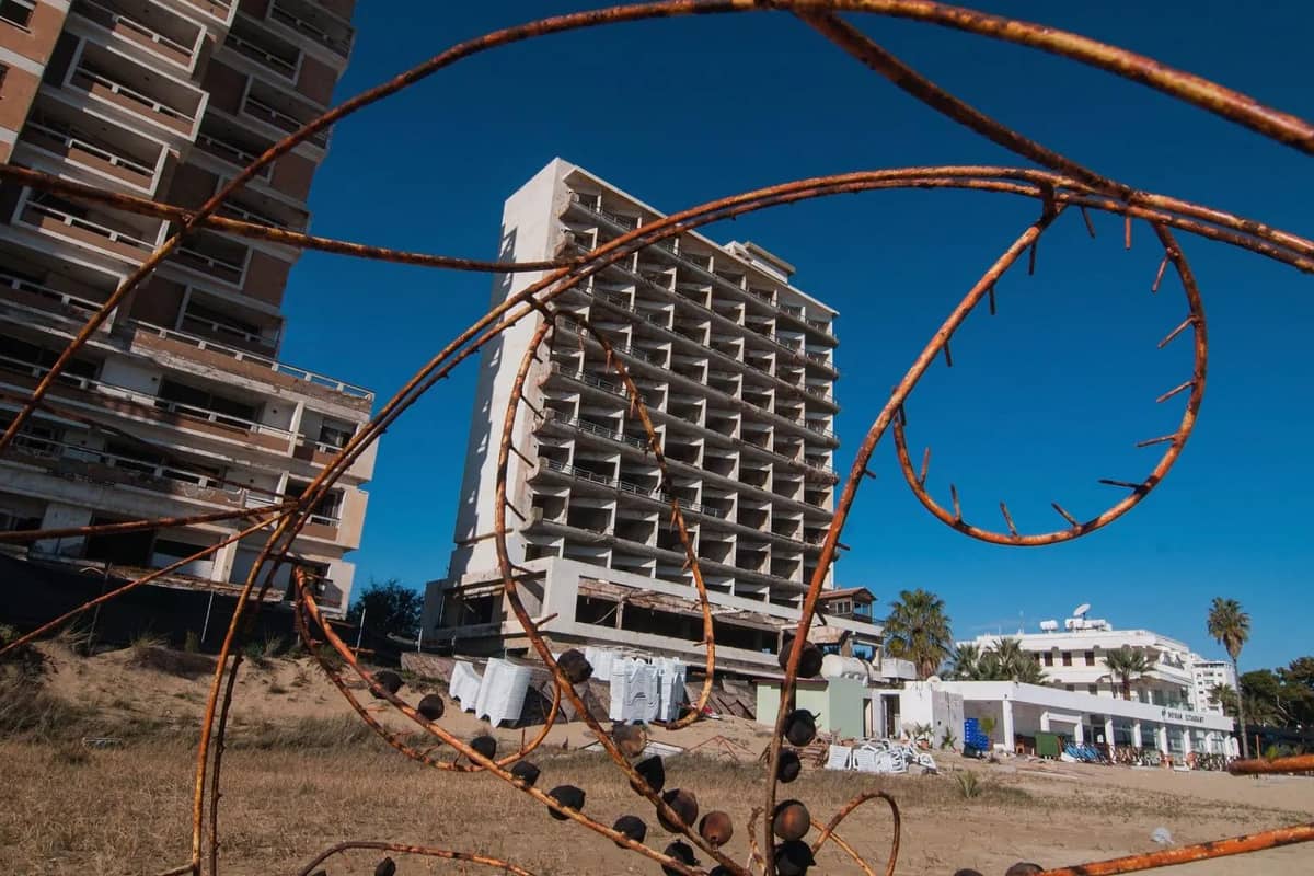 Abandoned high-rise hotels stand empty behind the beach of Varosha on a Famagusta ghost town tour