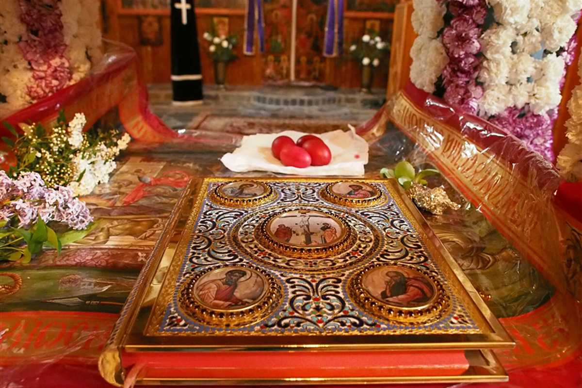 Decorated epitaphios surrounded by flowers inside a Greek Orthodox church on Good Friday