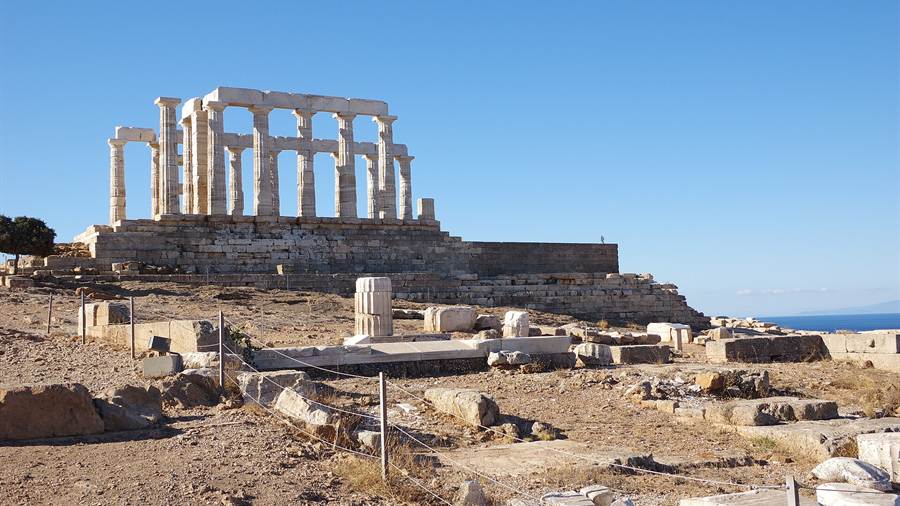 Marble columns of the Temple of Poseidon at Sounion under a blue sky