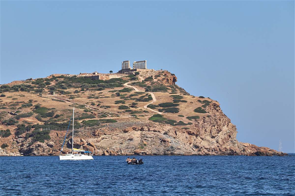 Temple of Poseidon standing on the headland of Cape Sounion above the sea