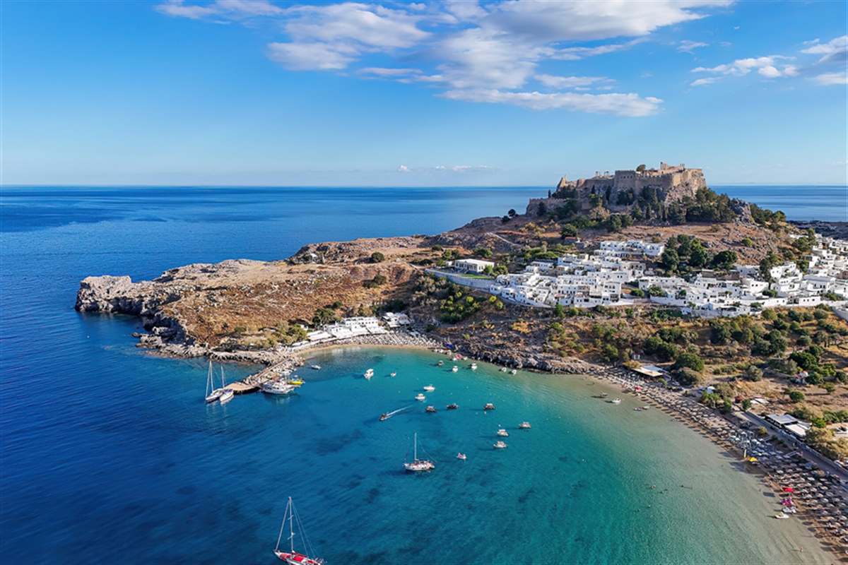 Aerial view of the Lindos Acropolis above the bay and village, Lindos Acropolis tickets
