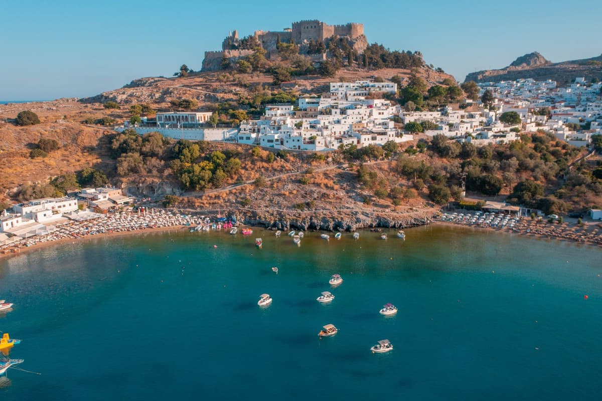 Aerial view of the acropolis, the white village and the bay of Lindos, the sights of a Lindos tour