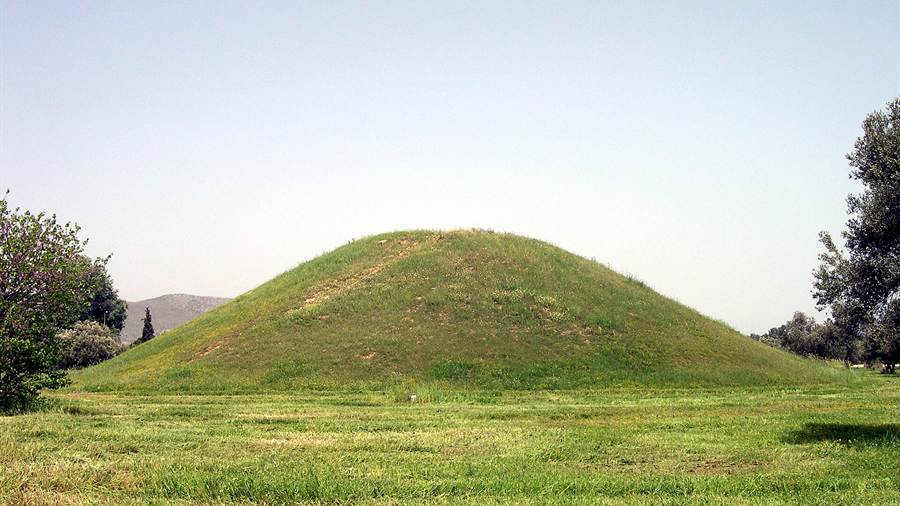 Round grassy tumulus of the Athenians on the plain of Marathon