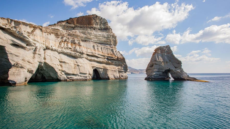 The white rock arches of Kleftiko, the best known stop of a Milos sailing tour