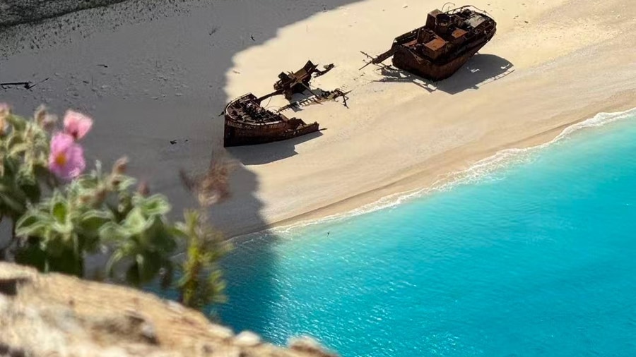The rusted wreck on the white beach of Navagio, seen on a Navagio shipwreck tour