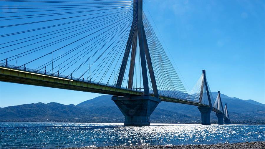 Rio-Antirrio bridge deck and cables stretching across the blue gulf