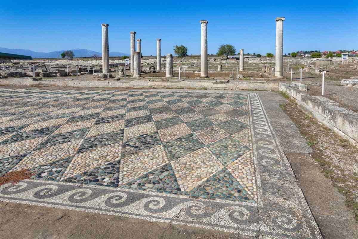 Geometric mosaic floors and standing columns of a house at the Pella archaeological site