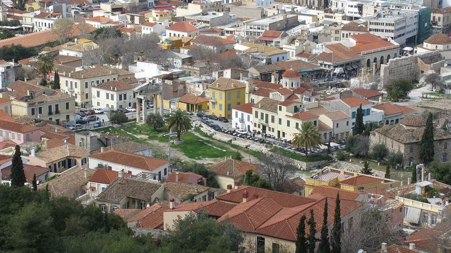 The red rooftops of Plaka below the Acropolis hill in Athens