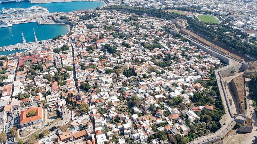 The walled Old Town of Rhodes and its harbour seen from the air on Rhodes tours