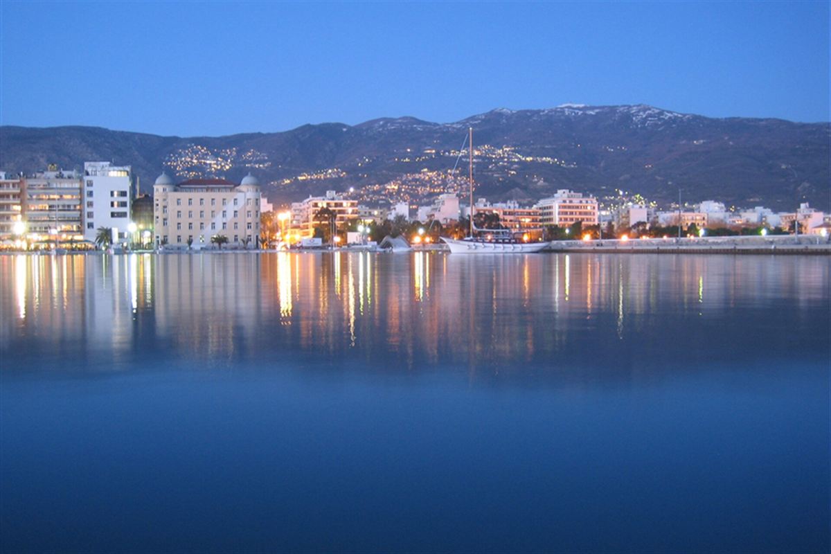 Evening lights along the waterfront of Volos with Mount Pelion behind, Volos tour