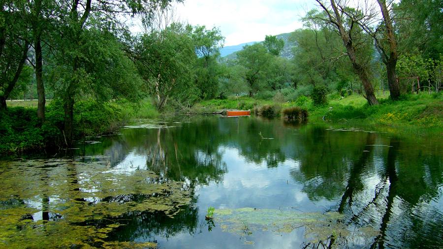 The Nestos river winding through a green valley near Xanthi in Thrace, a landscape on a Xanthi tour
